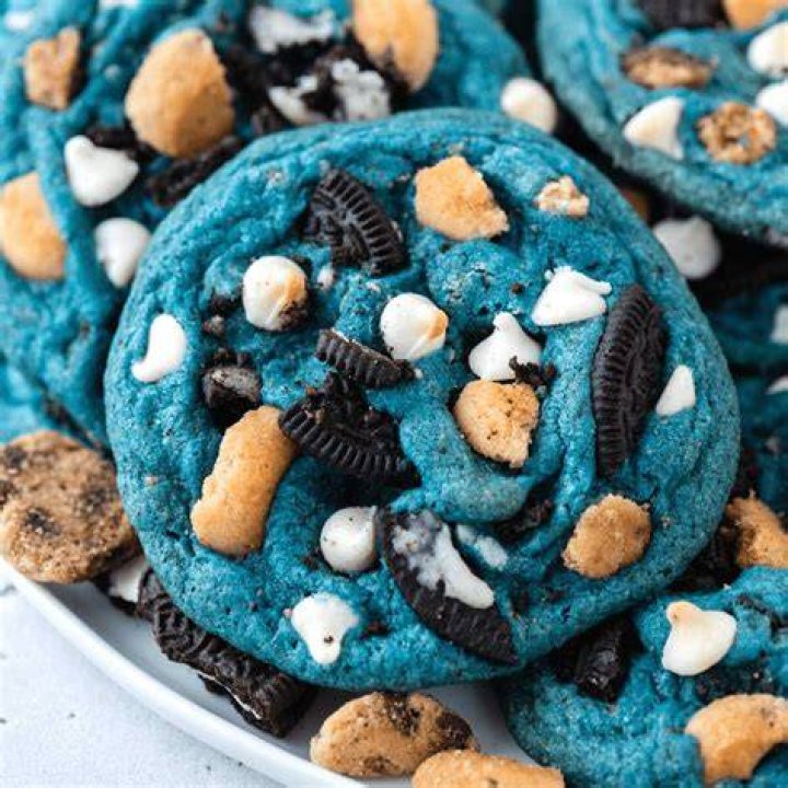 Monster cookie dough in a glass mixing bowl